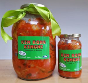 A monster-sized jar of Kim Kong Kimchi next to a regular one for scale